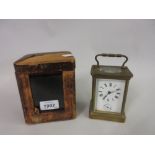 Small brass cased carriage clock, the enamel dial with Roman numerals and subsidiary alarm,