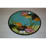 Japanese cloisonne plate decorated with flowers and foliage on a turquoise blue ground