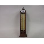 Oak cased thermometer by Negretti and Zambra,