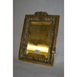 19th Century French pierced brass framed bevelled edge wall mirror with cherub mask head surmount,