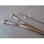 Two Charles Horner silver hat pins together with a pair of silver handled glove stretchers
