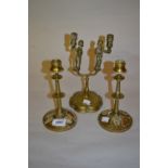 Pair of 19th Century French gilt brass candlesticks and a brass two branch figural candlestick