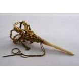 A MID 19TH CENTURY GILT-METAL POSY HOLDER with a turned mother of pearl handle, the openwork top