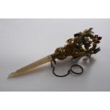 A 19TH CENTURY GILT-METAL POSY HOLDER  with a mother of pearl handle, decorated around the top