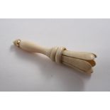 A MID 19TH CENTURY TURNED IVORY POSY HOLDER with a slotted top section & slider ring;  5"  (12.5