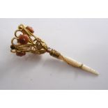 A MID 19TH CENTURY EARLY GILT-METAL POSY HOLDER with a turned mother of pearl handle, the top