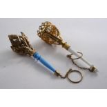 TWO MID 19TH CENTURY GILT-METAL POSY HOLDERS One with a white opaque glass handle; the other with