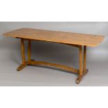 COTSWOLD SCHOOL DINING TABLE - OLIVER MOREL a brown oak refectory table, the top with a carved