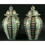 A PAIR OF CHINESE IMARI VASES AND COVERS, possibly late 18th century, of ovoid form, decorated