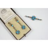 A PAIR OF TURQUOISE AND DIAMOND DROP EARRINGS of floral form, set with turquoise cabochons and