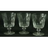 A SET OF SIX VICTORIAN DRINKING GLASSES, the bucket shaped bowls with faceted decoration above