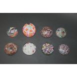 GLASS PAPERWEIGHTS including a Baccarat style paperweight with scattered canes on a muslin ground, a