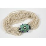 A SEED PEARL AND GEM SET BRACELET the twenty seven strands of seed pearls are set to a flower head