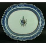 THREE CHINESE EXPORT ARMORIAL PLATTERS en suite to previous lot. 44cm and smaller. (3).