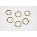 SIX ASSORTED 9CT. GOLD WEDDING BANDS total weight 15 grams.