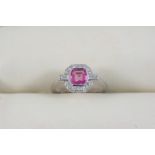 A PINK SAPPHIRE AND DIAMOND CLUSTER RING the square-shaped pink sapphire is set within a surround of