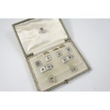 A CASED SET OF PLATINUM, DIAMOND AND BLACK ONYX CUFFLINKS AND DRESS STUDS each square-shaped