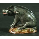 A MEISSEN FIGURE OF A WILD BOAR 19th Century, seated on a shaped oval base. Blue crossed swords