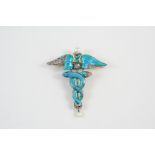 AN ART NOUVEAU ENAMEL, DIAMOND AND PEARL BROOCH with blue and green enamel decoration set to the