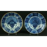 A PAIR OF DUTCH DELFT CHARGERS, later 18th century, painted with feathers and flowers in a vase