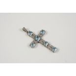 AN AQUAMARINE AND DIAMOND CRUCIFORM PENDANT set with six square-cut aquamarines and overall with