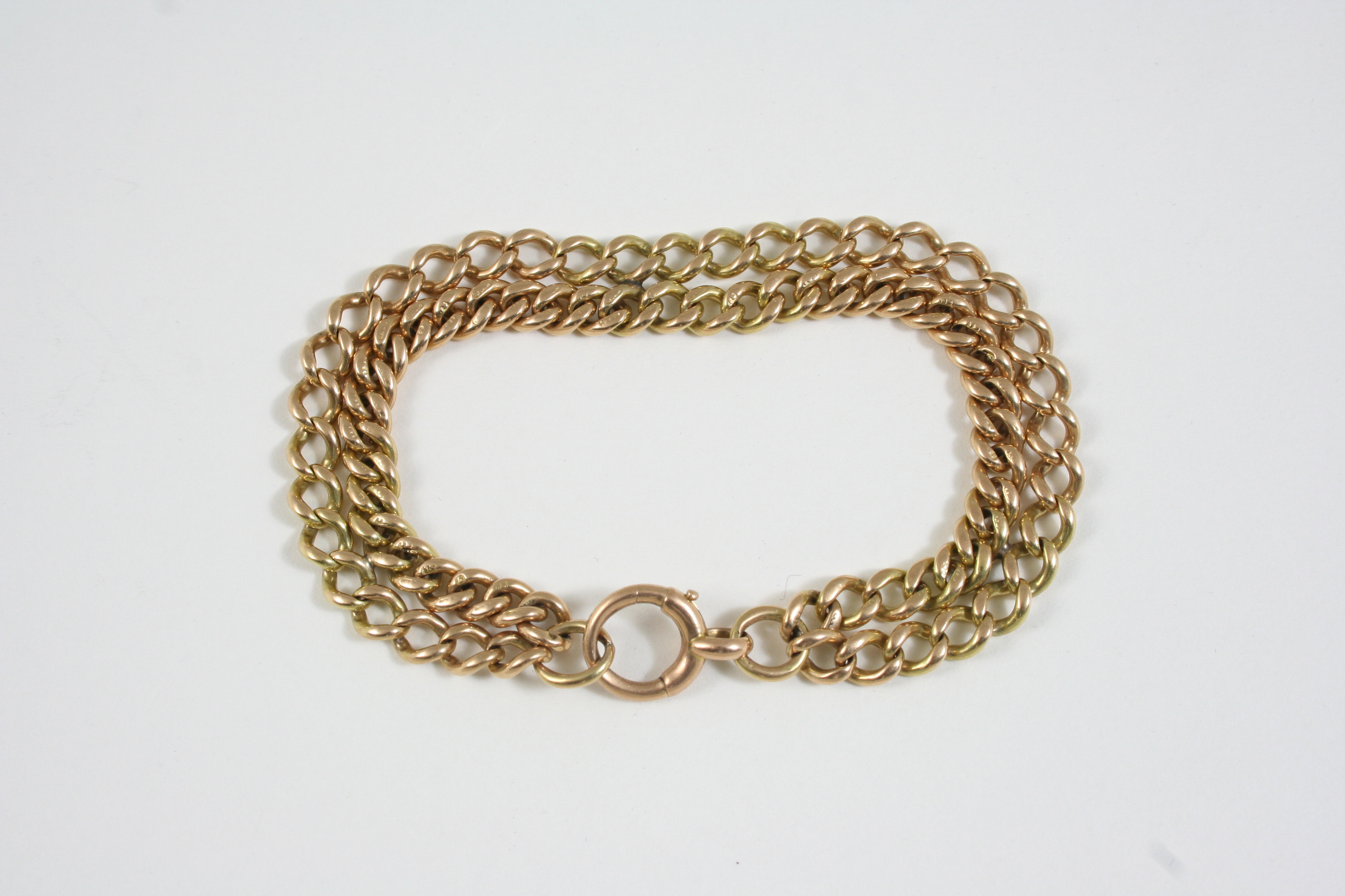 A 15CT. GOLD TWO ROW CURB LINK BRACELET 17.5cm. long, 24 grams.