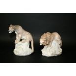 AMPHORA LION & LIONESS a Amphora model of a Lion perched on a rock, also with an Amphora Lioness