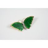 A JADE AND DIAMOND BUTTERFLY BROOCH the wings set with carved sections of jade, the body with