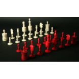 AN INDIAN TURNED RED AND WHITE BONE CHESS SET King 4ins. (10cms.) high