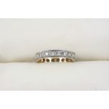 A DIAMOND FULL CIRCLE ETERNITY RING set with circular-cut diamonds, in gold. Size M.