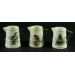 THREE ROYAL WORCESTER JUGS, signed Powell and Allen, date cipher 1919 and later, painted with a