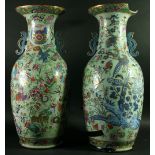 A PAIR OF CHINESE CANTON VASES of two-handled baluster form, famille rose decorated with birds,
