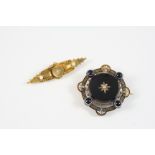 A VICTORIAN 15CT. GOLD BROOCH centred with a cushion-shaped diamond and with two small pearls, 5.