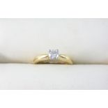 A DIAMOND SOLITAIRE RING set with a brilliant-cut diamond in 18ct. gold. Size M. Accompanied by