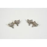 A PAIR OF DIAMOND FOX MASK CUFFLINKS each set overall with circular-cut diamonds, with ruby eyes, in