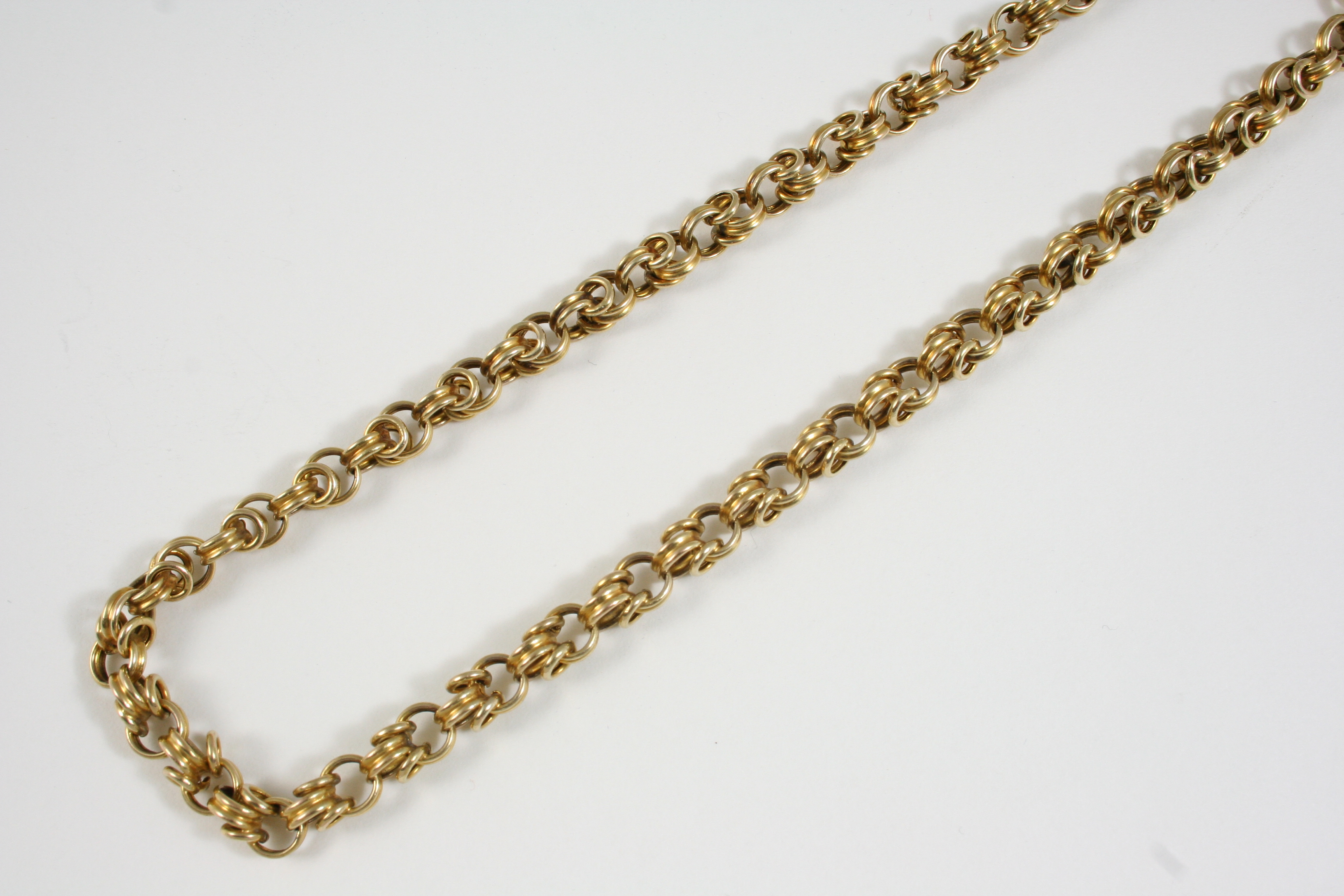 A 15CT. GOLD FANCY LINK NECKLACE 43.5cm. long, 29 grams.