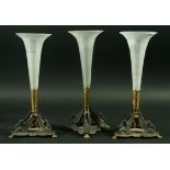 A SET OF THREE TABLE CENTRE PIECES, the frosted glass trumpet vases with Greek Key borders on gilt