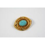 A VICTORIAN TURQUOISE AND GOLD BROOCH the oval centre section set with turquoise cabochons within