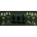 A PAIR OF 'BRISTOL GREEN' WINE GLASSES, 19th century, the flaring bowl with bulbous base, knopped