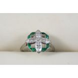 AN EMERALD AND DIAMOND FLOWER HEAD RING centred with four marquise-cut diamonds within a surround of