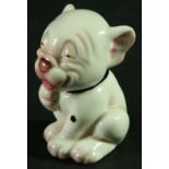 A ROYAL WORCESTER FIGURE OF BONZO, model 2855, date cipher for 1930, with a black collar, puce