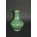 RUSKIN VASE the vase with a green tea dust glaze. Impressed mark, Ruskin. 8 1/4ins (21cms) high