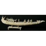 A THAI IVORY MODEL OF A PLEASURE BARGE with peacock prow and elephant stern, 30.5cm.
