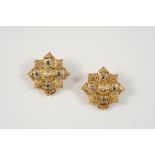 A PAIR OF 18CT. GOLD AND GEM SET EAR CLIPS BY LALALOUNIS each with embossed decoration, centred with