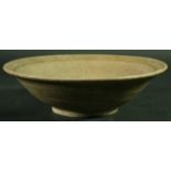 AN EARLY CELADON GLAZED BOWL, probably Thai Sawankhlok, with a crackled grey green glaze, 24.5cm