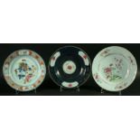 A COLLECTION OF TEN CHINESE FAMILLE ROSE PLATES painted with various floral scenes, all Qianglong,