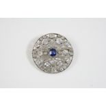 A BELLE EPOQUE SAPPHIRE AND DIAMOND BROOCH the circular openwork design is centred with a cushion-