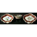 A PAIR OF CHAMBERLAINS WORCESTER BOTANICAL DISHES central floral specimen inside a burgundy and gilt