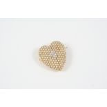 A DIAMOND AND HALF PEARL BROOCH PENDANT of heart-shape, centred with a cluster of small diamonds