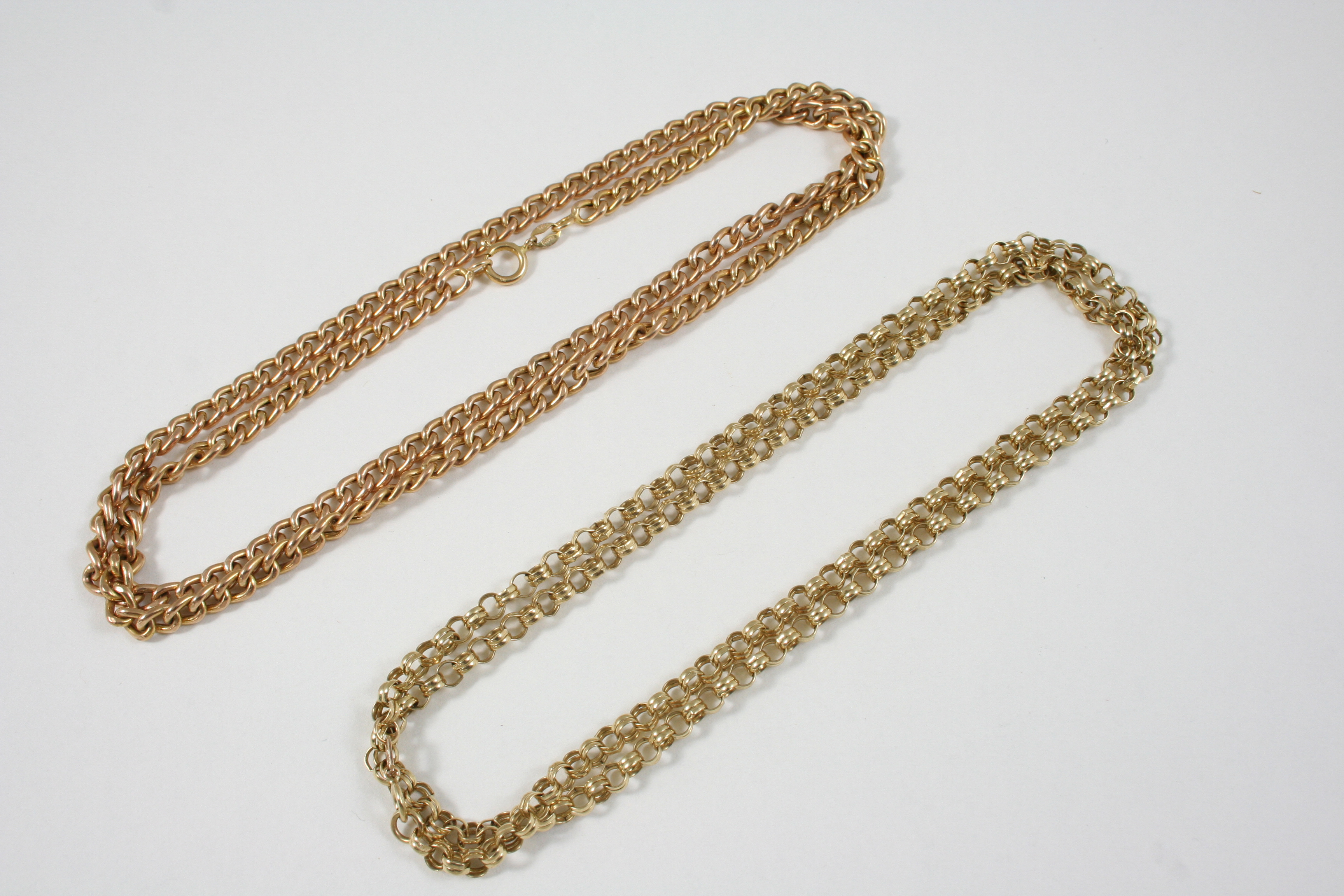 A 9CT. GOLD CURB LINK NECKLACE 60cm. long, 19 grams, together with a 9ct. gold circular link